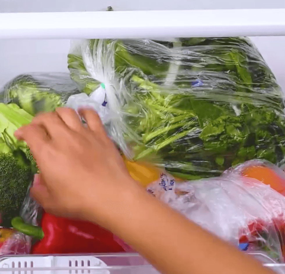 A messy drawer of vegetables