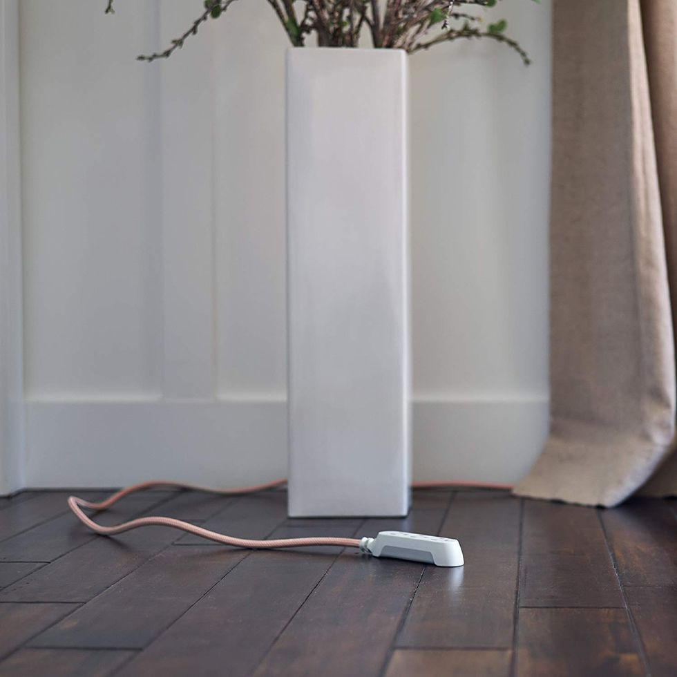 A nice looking extension cord stretched to the middle of the room.