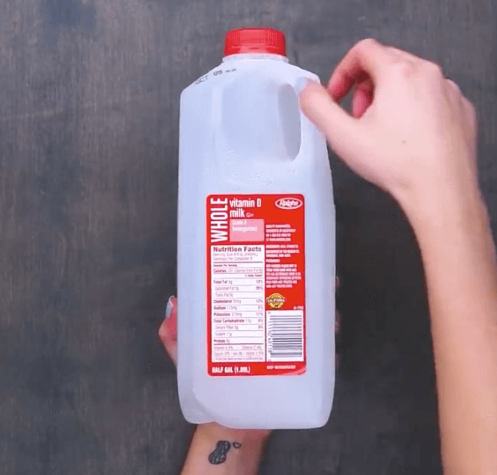 An empty half-gallon of milk