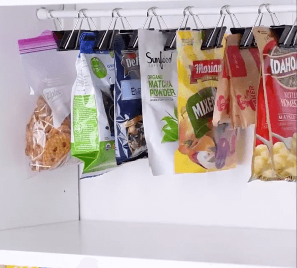 Bags are clipped into the binder clips to hold them neat and closed