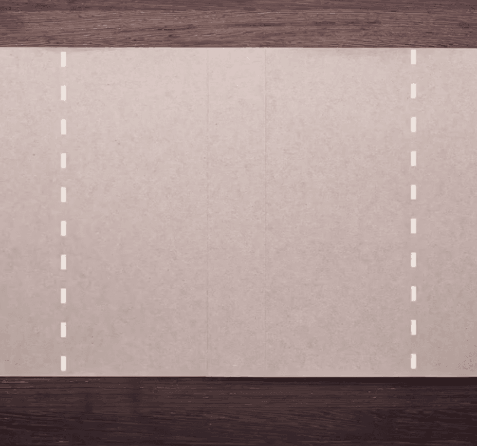Cardboard with two dotted white lines down the sides